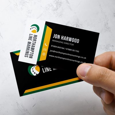Close up of mans hand holding business cards Close up of mans hand holding business cards
